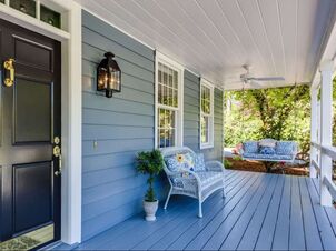 painted blue porch with black painted door