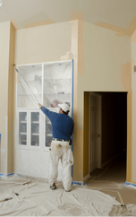 Professional interior painter painting high ceilings 